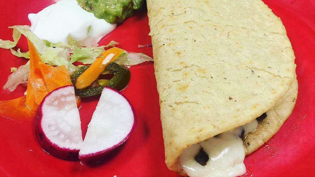 Quesadillas(2) · Two quesadillas made from flour tortillas or hand made corn tortillas with meat of your choice!