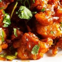 Gobi Manchurian (VEGAN) · Vegetarian. Crisped cauliflower, onion, tomato, bell pepper tossed in soy, garlic and cumin.