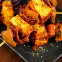 Methi Paneer Tikka (4 Cubes) · Gluten- Free. Cottage cheese, bell pepper, onion marinated in spices and skewered in a clay ...