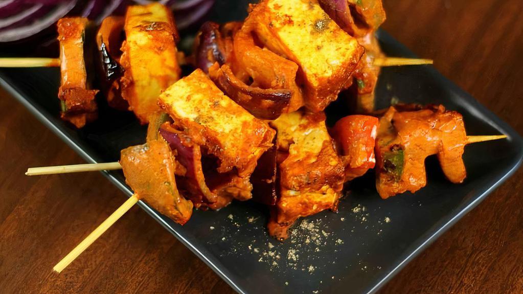 Methi Paneer Tikka (4 Cubes) · Gluten- Free. Cottage cheese, bell pepper, onion marinated in spices and skewered in a clay oven.
