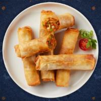 Rock N' Spring Roll · Deep-fried wrapped rice paper rolls stuffed with vegetables and bean thread noodles (clear n...