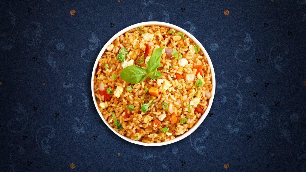 Thai Fried Rice · Fried rice with egg, carrot, onion and pea.