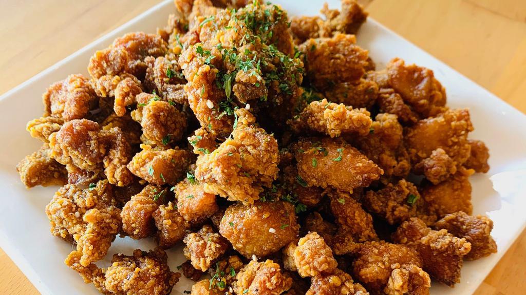 Momo Popcorn Chicken · Bite sized crispy fried chicken tossed  in house-made sweet and spicy sauce.