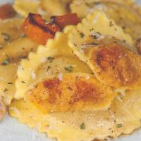 Pumpkin Ravioli · Pumpkin and butternut squash puree blended with Parmesan and mascarpone cheeses and brown su...