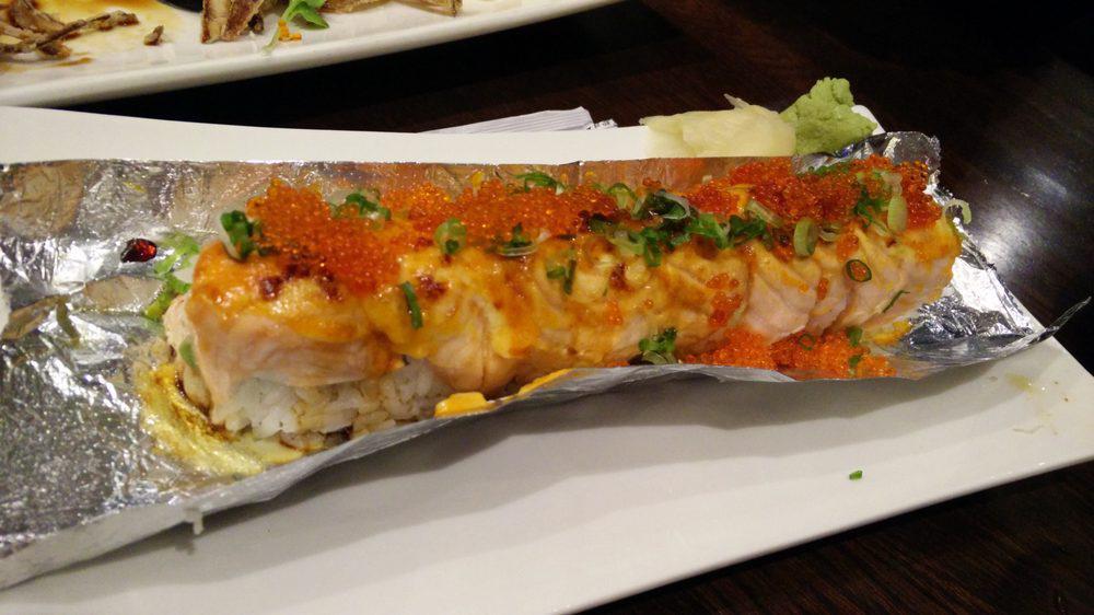 Lion King · Spicy. Crab, avocado topped with fresh salmon and baked with spicy mayo.