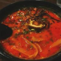 Spicy Garlic Tonkotsu Ramen · Pork base. Topped with chasiu, ground pork, green onion, menma, fungus, and half egg. Soup b...