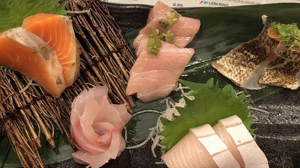 Omakase · 12 pieces of Chef's choice Sashimi. Your choice of miso soup or salad.
