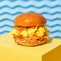 Loaded Breakfast Sandwich · Fried egg with caramelized onions, crispy hashbrowns, hot sauce, and your choice of cheese o...