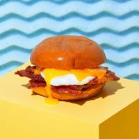 Turkey Bacon, Egg And Cheese · Crispy turkey bacon, a fried egg, and your choice of cheese on a brioche bun.