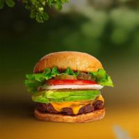 Vegan Avocado Burger · Seasoned vegan falafel patty topped with avocado, lettuce, tomato, onion, and pickles. Serve...