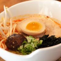 Spicy Miso Ramen · Topped with chashu, soft boiled egg, shiitake mushroom, seaweed, green onion, and sesame see...