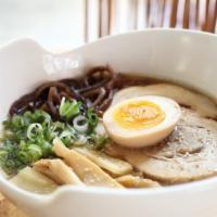 Chicken Shoyu · Chicken and fish broth, topped with grilled chicken, soft boiled egg, bamboo shoot, black fu...