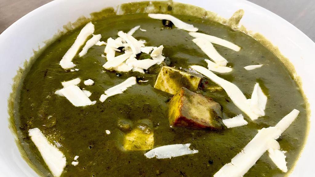Palak Paneer · Indian cottage cheese (paneer) cooked in creamy spinach gravy with spices