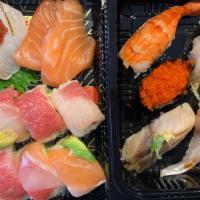 Sushi Deluxe · Chef Choice's 5 pieces Sushi, 4 pieces Sashimi and Rainbow Roll  w/Soup