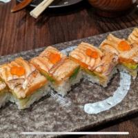Salmon Oshizushi · Seared salmon, avocado,  sesame seed, ikura and soy sauce.