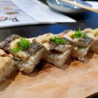 Saba Oshizushi · Seared mackerel, mint leaf, sesame seed, green onion, ginger, and ponzu sauce