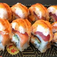 Ryoshin Roll · Eel, avocado topped with tuna, salmon, Imitation crab, sesame seed, green onion and house sa...