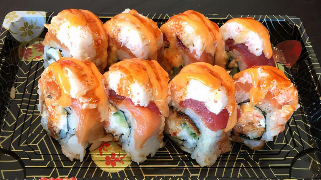Ryoshin Roll · Eel, avocado topped with tuna, salmon, Imitation crab, sesame seed, green onion and house sauce