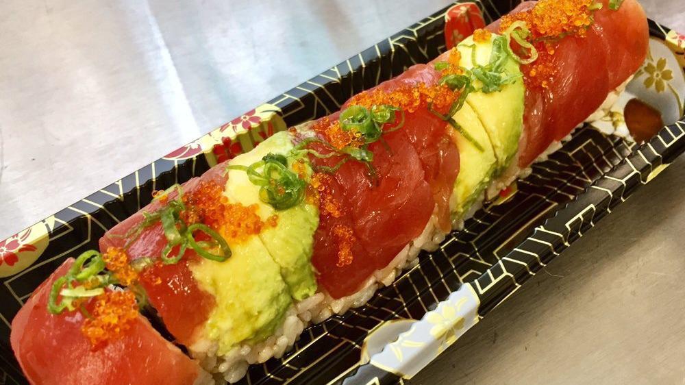 Crazy Roll · Spicy salmon, cucumber topped with avocado, tuna, eel sauce, sesame seed, green onion, and tobiko