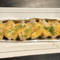 (Baked) Scallop Lover · Imitation crab, eel topped w/ bake scallop, spicy mayo sauce, eel sauce, sesame seed, and gr...