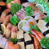 Combination Party Tray · Hamachi sashimi (4 pcs), shrimp sashimi (4 pcs), sake sashimi (4 pcs), scallop sashimi (4 pc...