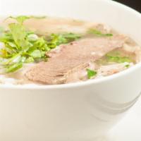1. Phó Đặc Biệt (House Special Pho) · Rice noodles with rare sliced eye round steak, well done brisket and flanks, tendon, and tri...