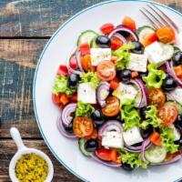 Greek Salad · Fresh salad with various greens, feta cheese, black and green olives, fresh tomatoes, and a ...