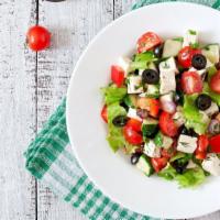 Tabouleh Salad · Mediterranean style salad with parsley, lettuce, and cucumbers.