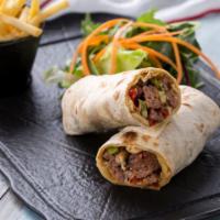 Steak Wrap With Fries · Marinated slices steak served with lettuce, tomatoes, onions and lavash bread with fries.