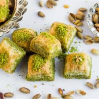 Pistachio Baklava · Tender pistachios nestled in layers of buttery flaky filo dough made with honey.