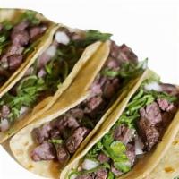 6 TACOS · Corn tortillas topped with meat, onions, cilantro and salsa
