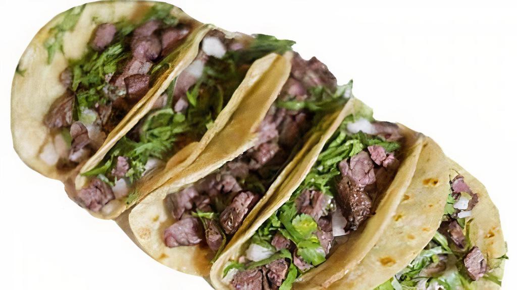 12 TACOS · Corn tortillas topped with meat, onions, cilantro and salsa