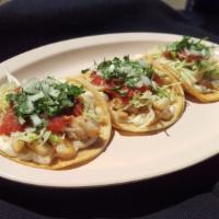 SHRIMP TACOS · 3 Grilled Shrimp tacos with mayonnaise, lettuce, onions, cilantro, and salsa.