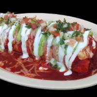 WET BURRITO · Vegetarian. Wet burrito with meat, beans, rice, topped with a thick red sauce, melted cheese...