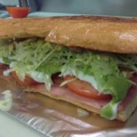 TORTA · Vegetarian. Mexican sandwich with meat, re fried beans, lettuce, tomatoes, sour cream, chees...
