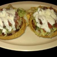 SOPES 2pcs · Vegetarian. Two thick corn masa tortillas topped with meat, refried beans, lettuce, sour cre...