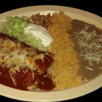 ENCHILADAS (2pcs) · Two corn tortillas filled with meat, topped with chili sauce and melted cheese,  served with...