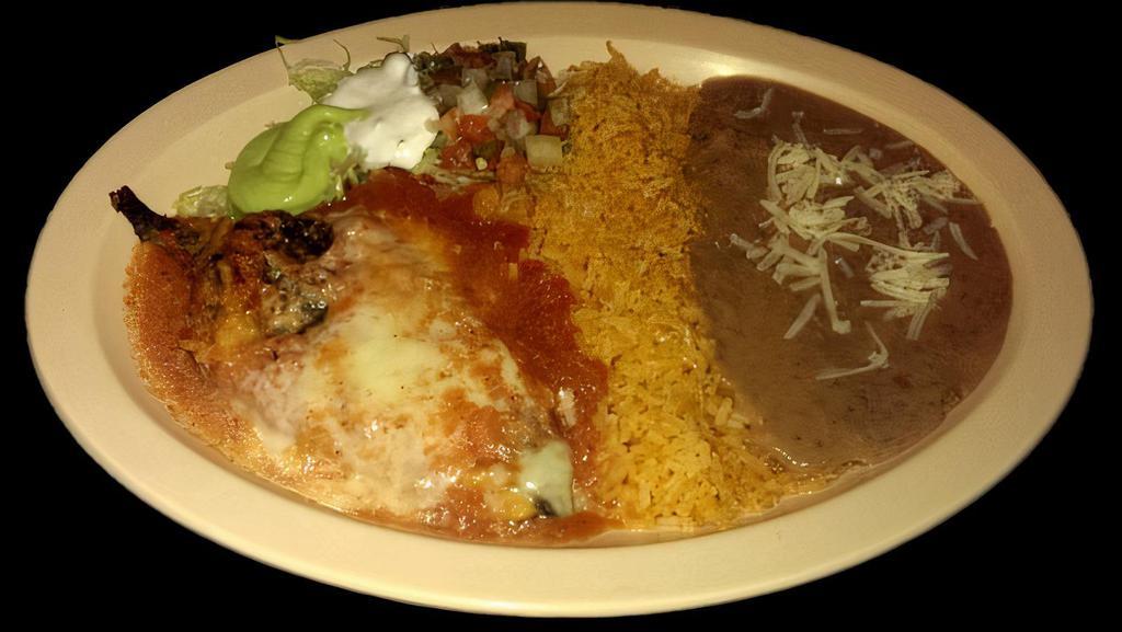 CHILE RELLENO PLATE · Vegetarian. Roasted pepper stuffed with cheese, covered in egg batter, and mild tomato sauce.  Served with rice, refried beans topped with cheese, lettuce, sour cream,  guacamole, salsa and corn tortillas.