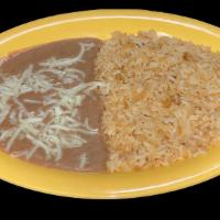 COMBO · Rice and refried beans topped with cheese.