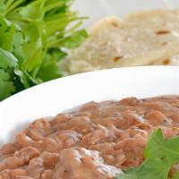 ORDER OF REFRIED BEANS · Topped with cheese.