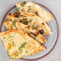 Garlic Naan (V) · Baked with minced garlic and cilantro sprinkle. Contains gluten, dairy, and eggs. We cannot ...