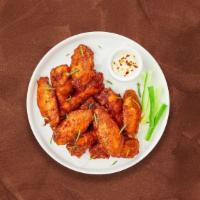 Classic Crispy Wings · Fresh chicken wings breaded and fried until golden brown. Served with a side of hot honey or...