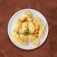 Parmesan Clove Wings · Fresh chicken wings breaded, fried until golden brown, and tossed in garlic and parmesan. Se...