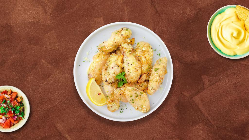 Parmesan Clove Wings · Fresh chicken wings breaded, fried until golden brown, and tossed in garlic and parmesan. Served with a side of hot honey or bleu cheese.