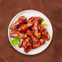 BBQ Cookout Wings · Fresh chicken wings breaded, fried until golden brown, and tossed in barbecue sauce. Served ...