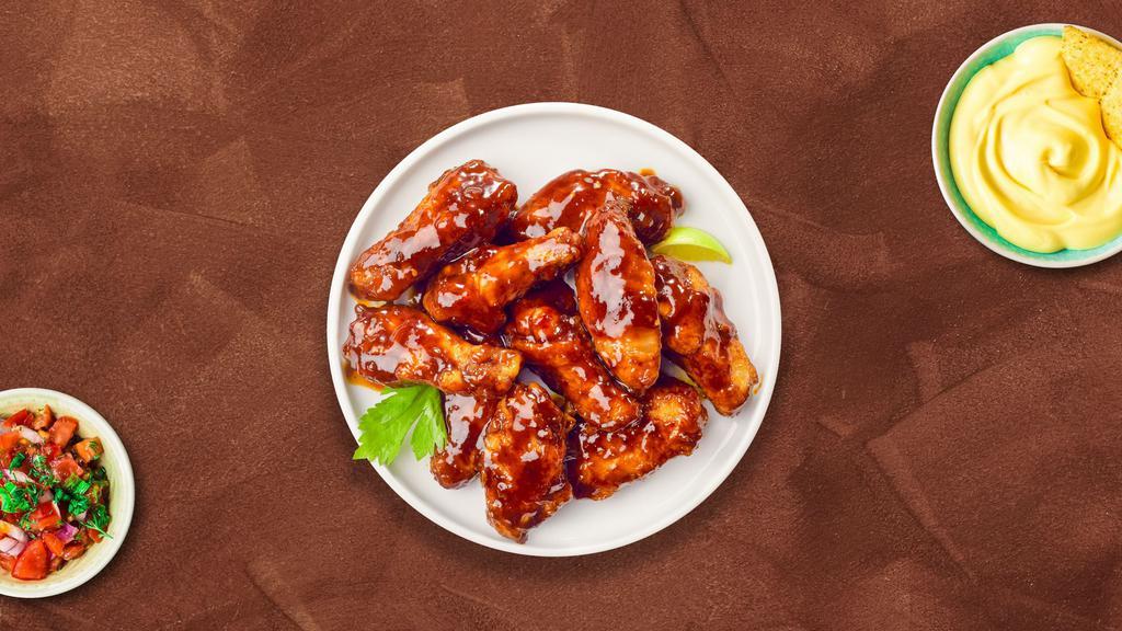 BBQ Cookout Wings · Fresh chicken wings breaded, fried until golden brown, and tossed in barbecue sauce. Served with a side of hot honey or bleu cheese.