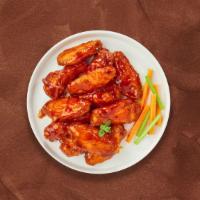 Buffalo Blaze Wings · Fresh chicken wings breaded, fried until golden brown, and tossed in buffalo sauce. Served w...