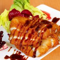 Tonkatsu · Batter deep-fried pork cutlet served with katsu sauce.