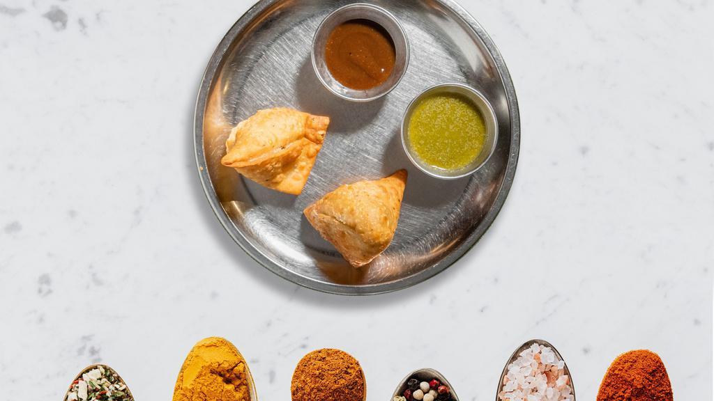 Samosa Kind of Wonderful · Tantalize your taste buds with this delicious dish. Idaho's potatoes mixed in a curry marinate and fried in a crispy wheat layer. Served with mint chutney. 2 Pieces. Vegan.