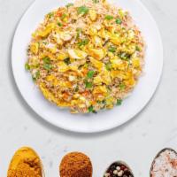 Egged on Fried Rice · Egg with basmati rice stir fried and cooked in Indian and Chinese sauces